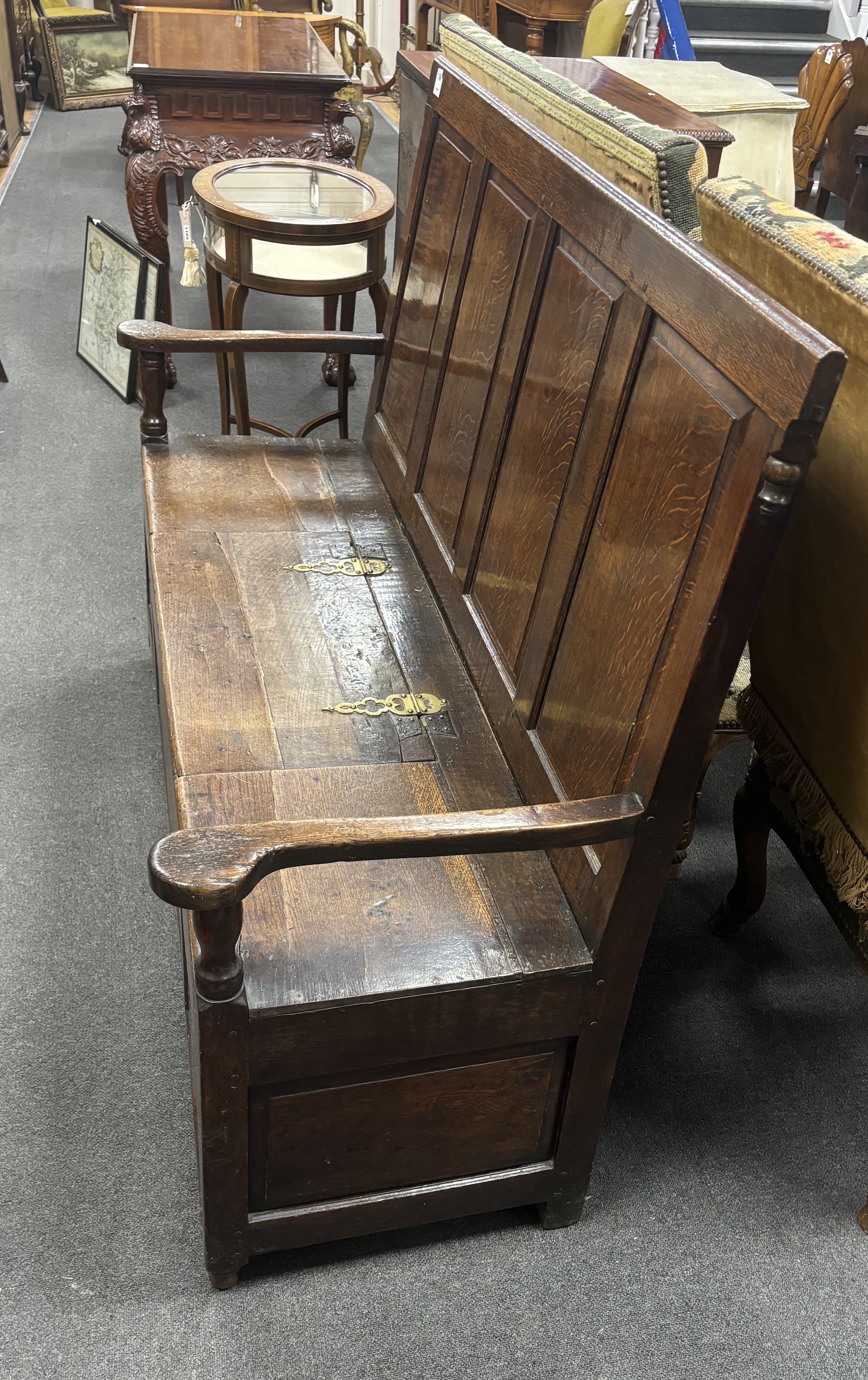 An 18th century panelled oak box seat settle, width 153cm, depth 51cm, height 108cm